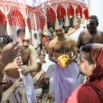 The titular Maharaja of Travancore, Sri Moolam Thirunal Rama Varma, welcoming the Jagadguru as State Guest by offering the Venkotta Kuda or Shweta Chatra, an official honour from the Kerala State Government